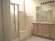 Bright bathroom with a large tub, a separate shower, and dual vanities at 7515 Splashing Rock Dr, Las Vegas, NV 89131