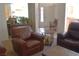 Entryway with seating, plants, and a view into the living and kitchen areas at 7515 Splashing Rock Dr, Las Vegas, NV 89131