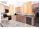 Bright kitchen with granite countertops, stainless steel appliances, and plenty of cabinet space at 7515 Splashing Rock Dr, Las Vegas, NV 89131