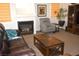 Relaxing living room featuring a fireplace, comfortable seating, and a stylish coffee table at 7515 Splashing Rock Dr, Las Vegas, NV 89131