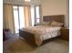 Spacious main bedroom with neutral carpet, en-suite bath, and backyard access at 7515 Splashing Rock Dr, Las Vegas, NV 89131