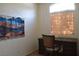 Home office featuring a desk, rolling chair, and natural light from the window at 7515 Splashing Rock Dr, Las Vegas, NV 89131