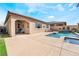 Inviting outdoor space with a sparkling pool, spa, and covered patio at 781 Drammatico Pl, Henderson, NV 89011