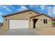 Charming single-story home with a two-car garage and desert landscaping at 790 E Basin, Pahrump, NV 89060