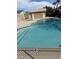 Community swimming pool and jacuzzi with a clean and well-maintained pool area at 8012 Draco Cir # 101, Las Vegas, NV 89128