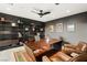 Stylish home office with a large desk, modern shelving, and comfortable leather chairs at 805 Magnum Cliff Ct, Henderson, NV 89012