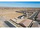 An aerial view of a neighborhood showcasing homes and desert surroundings at 8976 S Park St, Las Vegas, NV 89178