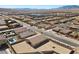 Neighborhood aerial view of backyard, desert landscape, and serene mountain backdrop, creating a peaceful and desirable community setting at 8976 S Park St, Las Vegas, NV 89178