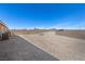 Large backyard with a retaining wall and a soccer net, perfect for outdoor activities at 8976 S Park St, Las Vegas, NV 89178