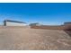 Open backyard with a retaining wall, providing ample space for a variety of outdoor activities at 8976 S Park St, Las Vegas, NV 89178