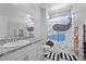 Lovely bathroom with granite countertops and a whimsical shower curtain at 8976 S Park St, Las Vegas, NV 89178