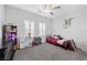 Charming bedroom with carpet, window shutters, and ceiling fan at 8976 S Park St, Las Vegas, NV 89178