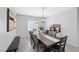 Elegant dining room with modern lighting fixtures and stylish decor at 8976 S Park St, Las Vegas, NV 89178