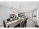 Open dining area boasts a spacious table and plenty of natural light at 8976 S Park St, Las Vegas, NV 89178