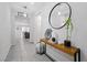 Hallway featuring modern decor, tile flooring, and an open living space at 8976 S Park St, Las Vegas, NV 89178