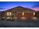 Charming single-story home with a two-car garage and desert landscaping at 8976 S Park St, Las Vegas, NV 89178