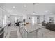 Spacious kitchen featuring granite countertops, stainless steel appliances, and an island with bar seating at 8976 S Park St, Las Vegas, NV 89178