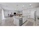 Open concept kitchen features a large island and stainless steel appliances at 8976 S Park St, Las Vegas, NV 89178