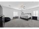 Spacious bedroom with plush carpeting, neutral tones, and shuttered windows at 8976 S Park St, Las Vegas, NV 89178