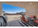 Inviting covered patio with outdoor seating, offering a relaxing space with views of the backyard at 8976 S Park St, Las Vegas, NV 89178