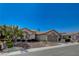 Charming single-story home with well-maintained landscaping and a two-car garage at 10025 Netherton Dr, Las Vegas, NV 89134