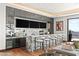 Stylish bar featuring marble countertops, modern lighting, and multiple screens for entertainment at 11 Rockstream Dr, Henderson, NV 89012