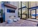 Modern courtyard with fireplace, stylish seating, and seamless indoor-outdoor transition at 11 Rockstream Dr, Henderson, NV 89012