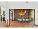 Dining area with modern decor, featuring a large golden sphere art piece and elegant table setting at 11 Rockstream Dr, Henderson, NV 89012