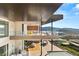 Luxury home featuring an open layout, balconies with glass railings, and amazing views of the surrounding landscape at 11 Rockstream Dr, Henderson, NV 89012