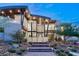 Elegant home with modern design, featuring large windows and meticulous landscaping at 11 Rockstream Dr, Henderson, NV 89012