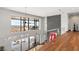 Open hallway overlooking a modern living space with floor-to-ceiling windows and a sleek design at 11 Rockstream Dr, Henderson, NV 89012