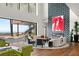 Stylish living room featuring a fireplace, modern decor, and panoramic views through large windows at 11 Rockstream Dr, Henderson, NV 89012