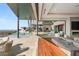 Indoor/outdoor living space with a pool view, comfortable seating, and seamless transition to the backyard at 11 Rockstream Dr, Henderson, NV 89012