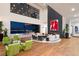 Spacious living room with a sleek fireplace, modern furniture, and floor-to-ceiling windows overlooking the city at 11 Rockstream Dr, Henderson, NV 89012
