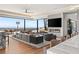 Spacious living room with floor-to-ceiling windows offering city views, a fireplace, and modern furnishings at 11 Rockstream Dr, Henderson, NV 89012