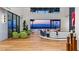 Modern living room with wood floors, bright seating, and expansive views of the city skyline at 11 Rockstream Dr, Henderson, NV 89012