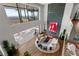 Grand living room with an open layout, modern fireplace, and expansive city views from the balcony at 11 Rockstream Dr, Henderson, NV 89012