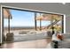 Panoramic view of the city skyline and outdoor living area, visible from the spacious living room at 11 Rockstream Dr, Henderson, NV 89012