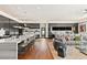 Open-concept living area with a large marble island, sleek cabinetry, and a cozy seating area at 11 Rockstream Dr, Henderson, NV 89012