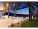 Covered patio featuring a pool, fire pit, lounging area and scenic views at 11 Rockstream Dr, Henderson, NV 89012