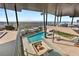 Expansive pool area with fire pit, spa, and stunning panoramic city views from the elevated patio at 11 Rockstream Dr, Henderson, NV 89012