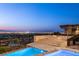 Elevated pool and spa offering panoramic views of the city skyline at dusk at 11 Rockstream Dr, Henderson, NV 89012