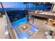 Stunning infinity pool, fire pit, and lounge area create an outdoor oasis with captivating city skyline views at 11 Rockstream Dr, Henderson, NV 89012