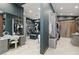 Spacious walk-in closet with vanity, custom shelving, and ample storage for wardrobe and accessories at 11 Rockstream Dr, Henderson, NV 89012