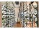 Wine cellar featuring sleek metal racks displaying a large collection, complete with a rolling ladder at 11 Rockstream Dr, Henderson, NV 89012