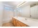 Bright bathroom boasts a double sink vanity and a tub-shower combo at 11017 Ladyburn Ct, Las Vegas, NV 89141