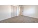 This is a neutral bedroom featuring carpet, white walls, closet, and doorway at 1209 S 17Th St, Las Vegas, NV 89104