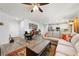 Spacious living room showing open concept with kitchen, great natural light and wood-look floors at 1241 Yosemite Ave, Pahrump, NV 89048