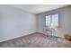 Bedroom with carpet, plantation shutters, white writing desk and white stool at 1420 Ibizo St, Las Vegas, NV 89117