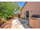 Backyard featuring desert landscaping and an outdoor kitchen at 1562 Pimlico Hills St, Henderson, NV 89014